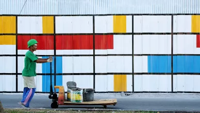 man painting on the wall