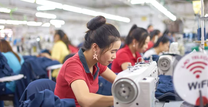 Workers sewing.