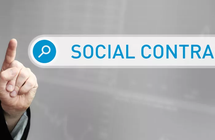 A man in a suit pointing a finger at a search box overlay with the word social contract is in the search