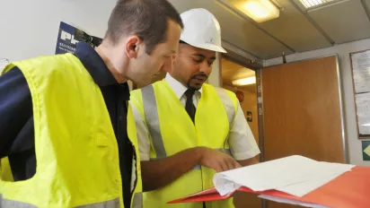 Inspector checking a ship's compliance with safety standards