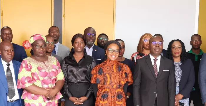 Participants to a capacity development activity pose for a group picture