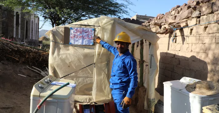 a young repairing appliances